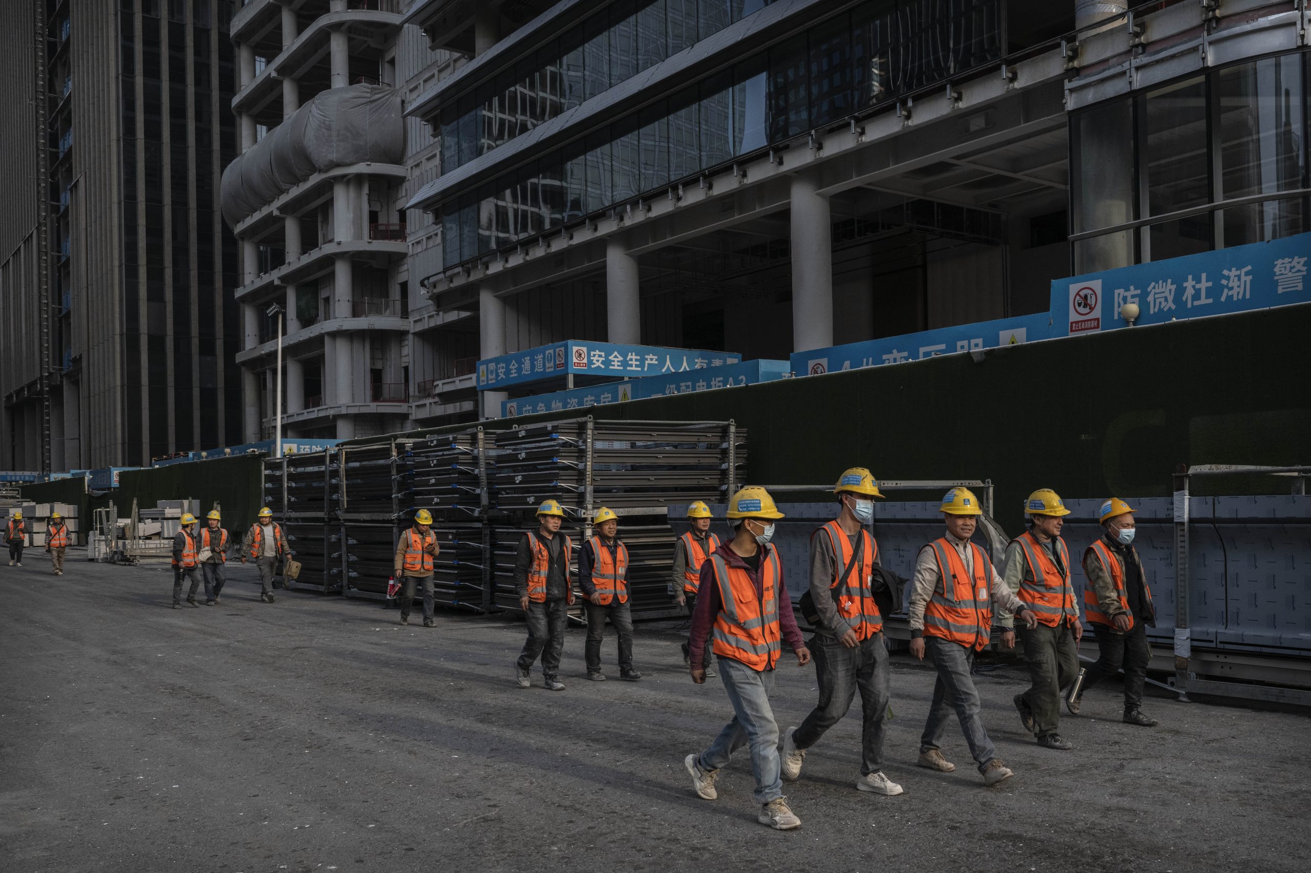 Construction workers leave a work site in the Central Business District in Beijing, China on April 10, 2025. | Source: Getty Images