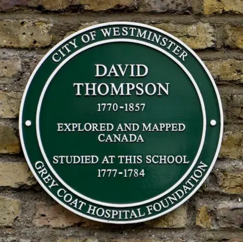 Grey Coat Hospital Foundation A green plaque on the wall of Grey Coat school. The white writing reads : "David Thompson, 1770-1857, Explored and mapped Canada, Studied at this school, 1777-1784. Grey Coat Hospital Foundation" It was unveiled in 2009 by explorer and TV personality Ray Mears.